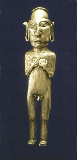 Empty anthropomorphic figure made of silver representing a male person with his arms across his c?