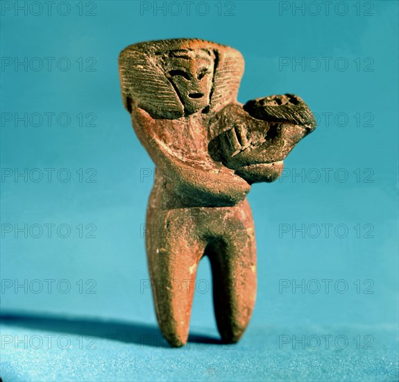 Female Figure with a newborn in arms, from a rubbish dump excavated near the town of Valdivia. Th?