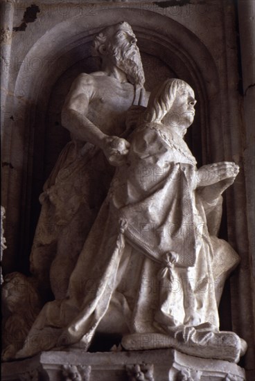 Praying statue of Don Manuel in the façade of the Jeronimos Monastery in Lisbon.