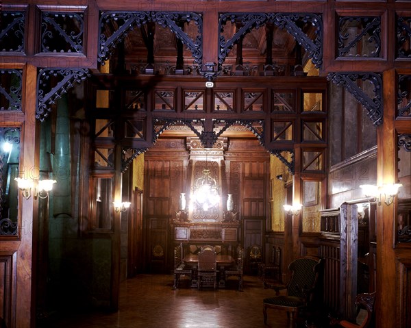 Perspective view of the main dining room of the Güell Palace with the original furniture, 1886-18?