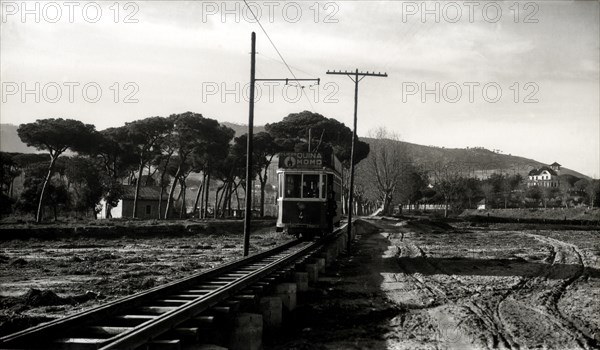 Argentona Mataró Tram crossing the pontoon on the river of Argentona, on a postcard of the 1920.