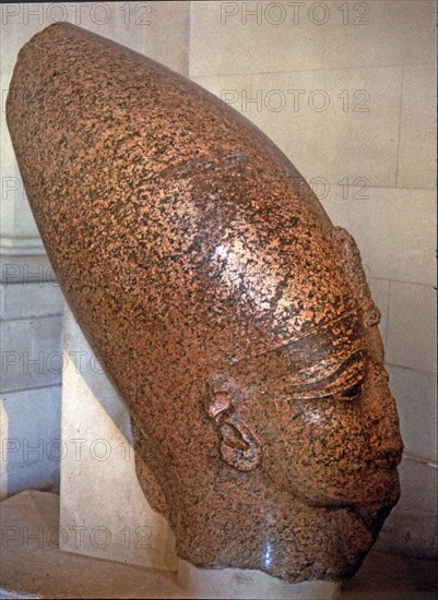 Head of Amenhotep III, on pink granite, it comes from his temple at Thebes.