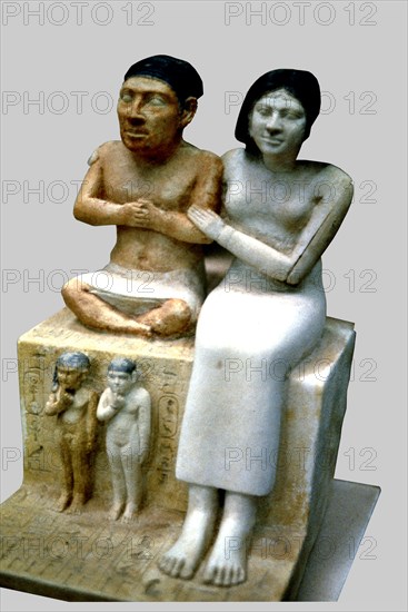 The dwarf Seneb, his wife and two daughters. It comes from Giza.