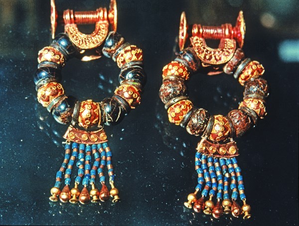 Gold earrings and jewels from the grave goods in Tutankhamun's tomb treasury.