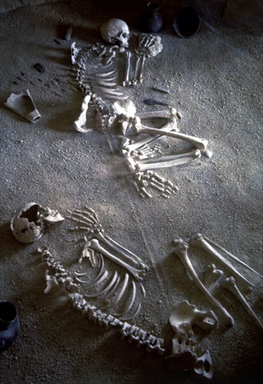 Collective burial, necropolis Ponte San Pietro (Lazio), detail of two adult skeletons of a man an?