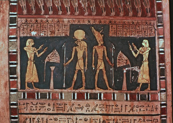 Stela in wood representing the deceased Ba-s-Turefi before the god Atum and Ra-Haharchte, from Th?