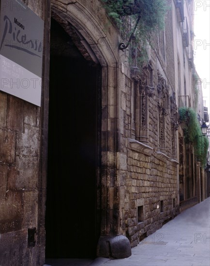 A corner of Montcada street in Barcelona with the Picasso Museum entry.