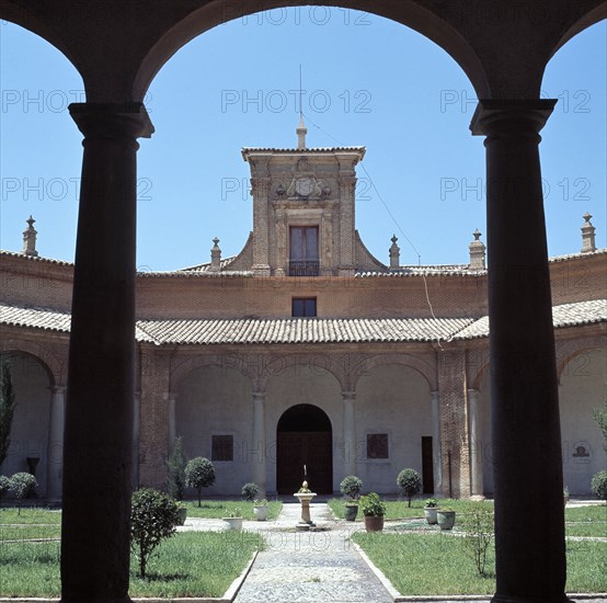 View through a round arch of the courtyard of the former Literary University of Huesca, which tod?