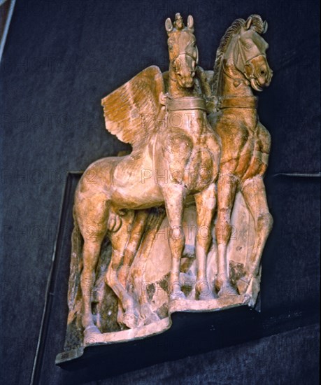 Winged horses, carved on Etruscan terracotta.