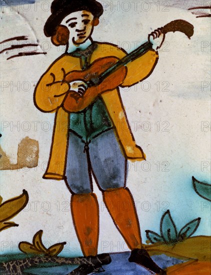 Catalan ceramics, polychromed tile of the series 'Trade Tiles'. Musician.