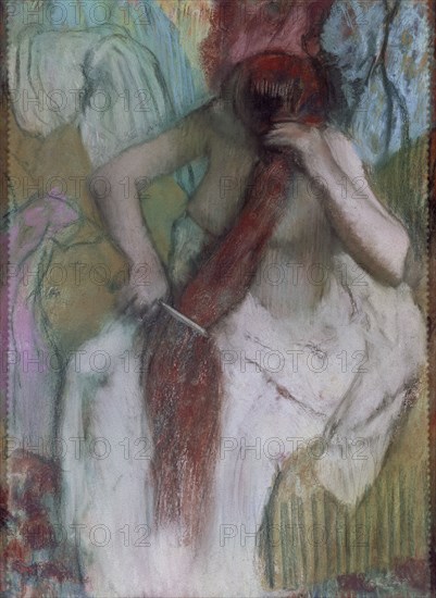 'Woman combing', Painted between 1887 and 1890 by Edgar Degas.