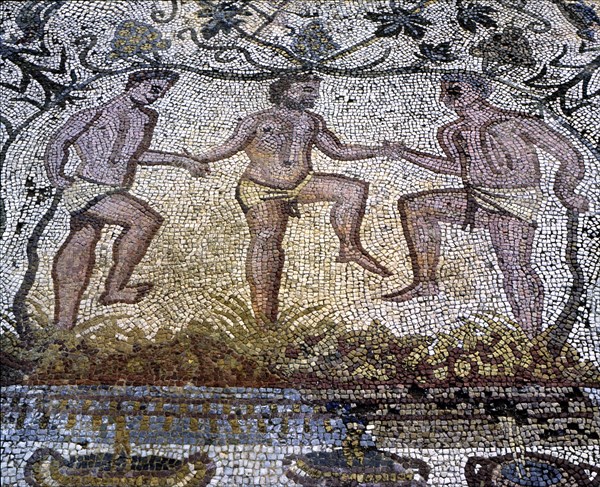 Mosaic in the Amphitheatre house representing treading grapes, preserved in the archaeological si?