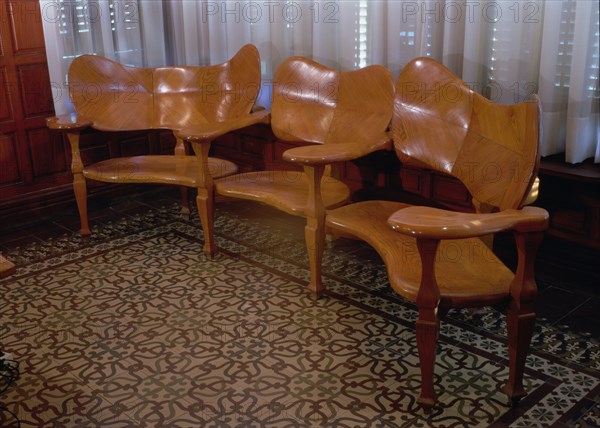 Wood sofa in the dining room of the Casa Batllo, 1904-1906, designed by Antoni Gaudi.