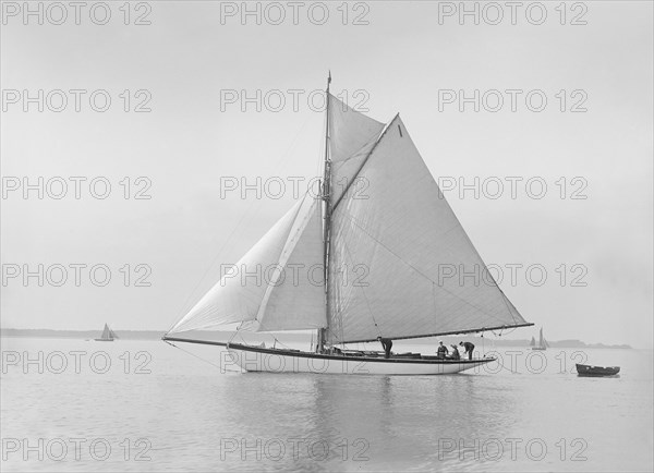 The cutter 'Wenda' in light winds, 1912. Creator: Kirk & Sons of Cowes.