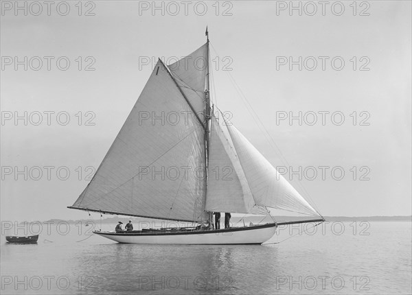 The cutter 'Wenda' in light winds, 1912. Creator: Kirk & Sons of Cowes.