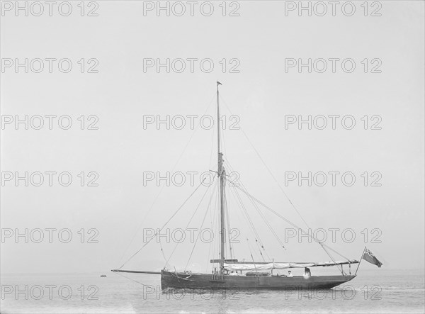 The cutter 'Cymberline' under way by motor. Creator: Kirk & Sons of Cowes.