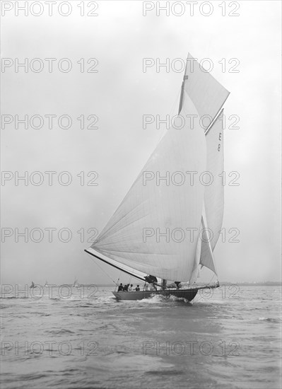 Gold medal winner 'Rollo' races downwind under spinnaker, 1911. Creator: Kirk & Sons of Cowes.