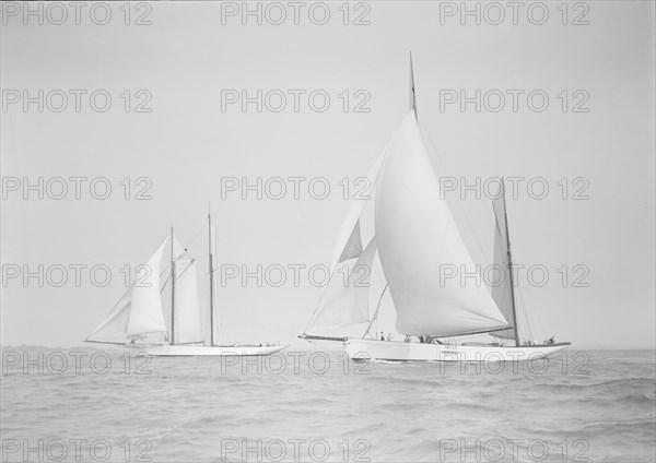 The ketch 'Cariad' and schooner 'Irma' racing downwind, 1911. Creator: Kirk & Sons of Cowes.