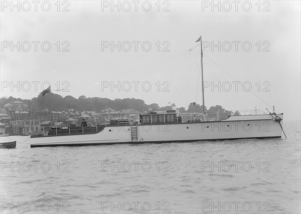 The 12 ton motor yacht 'Cordon Rouge' at anchor, 1923. Creator: Kirk & Sons of Cowes.