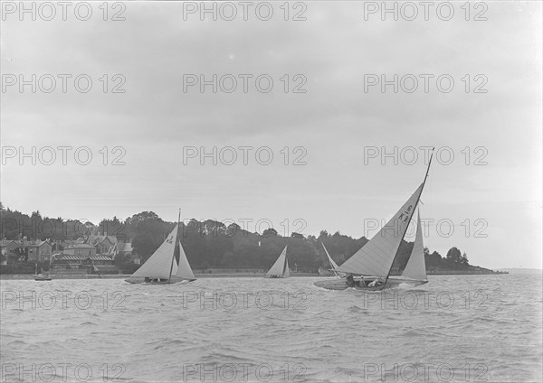 Group of 6 Metre yachts racing upwind, 1921.  Creator: Kirk & Sons of Cowes.