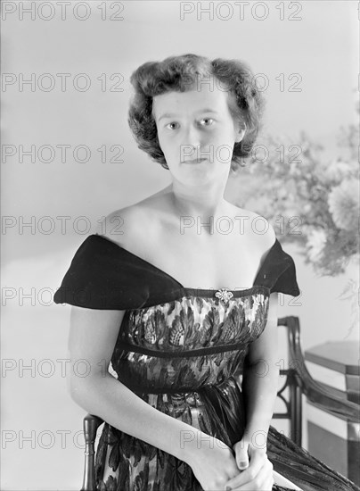 Portrait of seated woman in evening dress, (Isle of Wight?), c1935.  Creator: Kirk & Sons of Cowes.