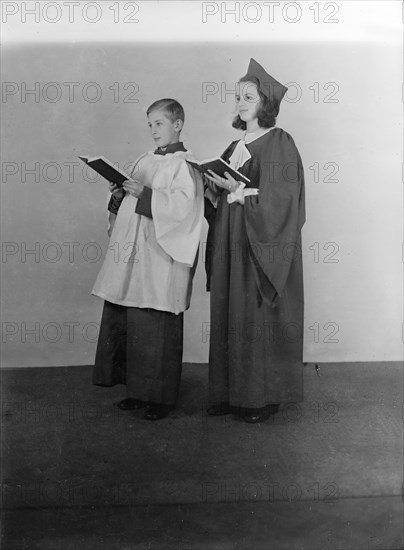 Girl and boy chorister, (Isle of Wight?), c1935. Creator: Kirk & Sons of Cowes.