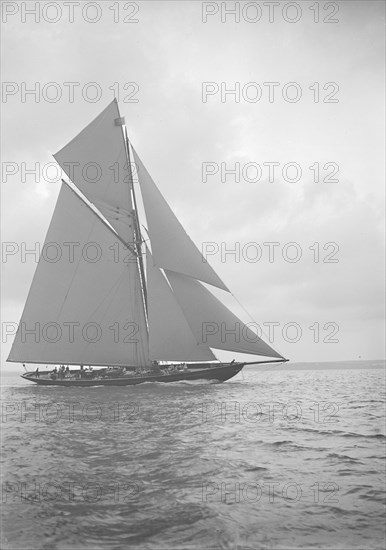 The 221 ton gaff-rigged cutter 'Britannia' sailing close-hauled, 1913. Creator: Kirk & Sons of Cowes.