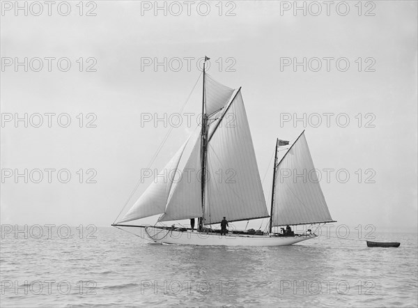 The yawl 'Meander' sailing in fine conditions, 1913. Creator: Kirk & Sons of Cowes.