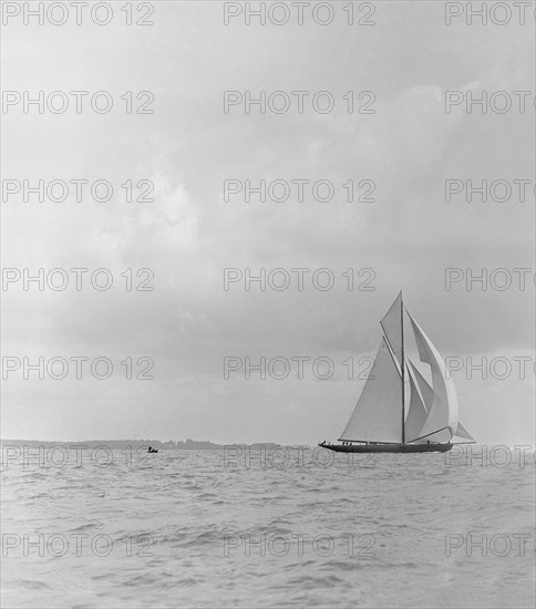 The racing cutter 'Terpisichore' running downwind, 1922. Creator: Kirk & Sons of Cowes.