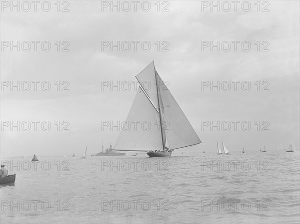 The racing cutter 'Terpisichore' running downwind, 1922. Creator: Kirk & Sons of Cowes.