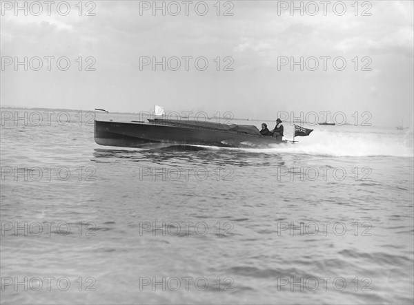 The hydroplane 'Izme' under way, 1913. Creator: Kirk & Sons of Cowes.