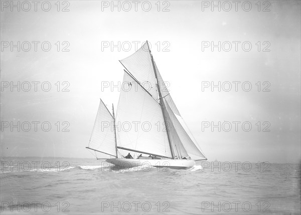 The yawl 'Celia' under way, 1911. Creator: Kirk & Sons of Cowes.