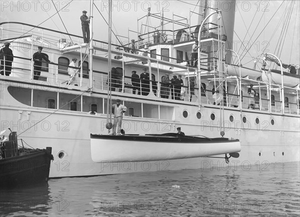 Lowering Liberty's motor launch, 1914. Creator: Kirk & Sons of Cowes.