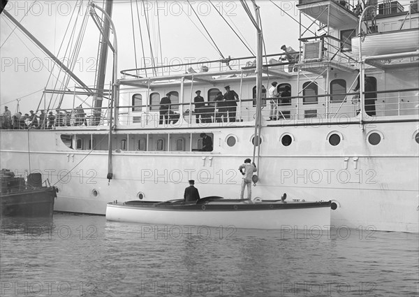 Liberty's motor launch alongside 'Liberty', 1914. Creator: Kirk & Sons of Cowes.