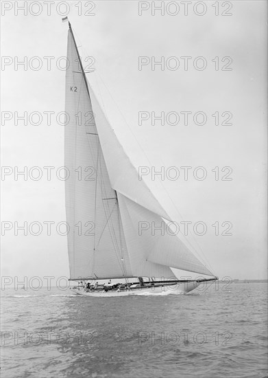 The 23-metre cutter 'Astra' sailing close-hauled, 1933. Creator: Kirk & Sons of Cowes.