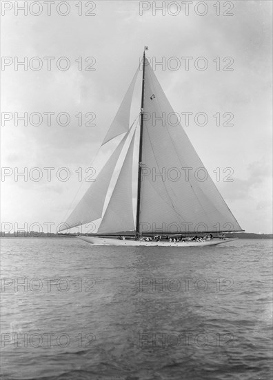 The 23-metre cutter 'Astra' sailing close-hauled. Creator: Kirk & Sons of Cowes.