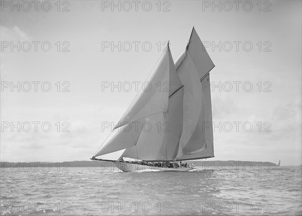 The 250 ton schooner 'Germania' sails close reach, 1911. Creator: Kirk & Sons of Cowes.