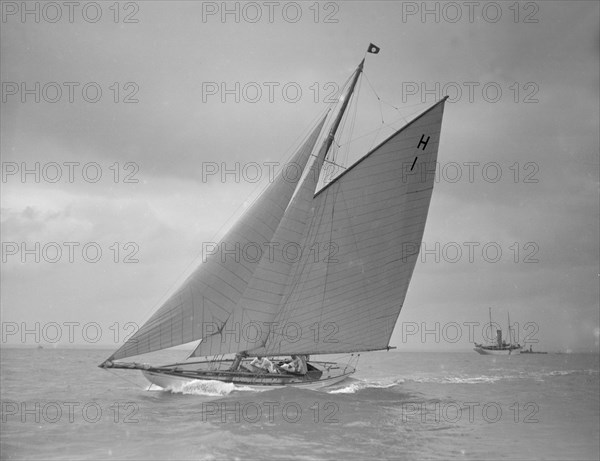 The 8 Metre class yacht 'Norman' (H1) sailing close-hauled, 1911. Creator: Kirk & Sons of Cowes.