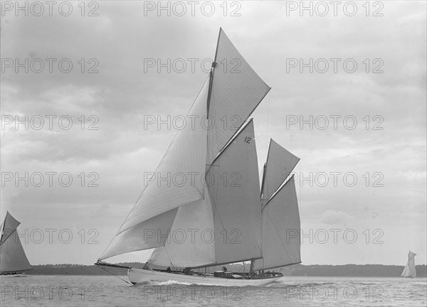 The 118 foot racing yacht 'Cariad' sailing close-hauled, 1911. Creator: Kirk & Sons of Cowes.