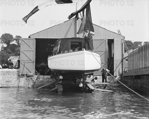 Saunders' motor launch on slipway ready for launching, 1908. Creator: Kirk & Sons of Cowes.