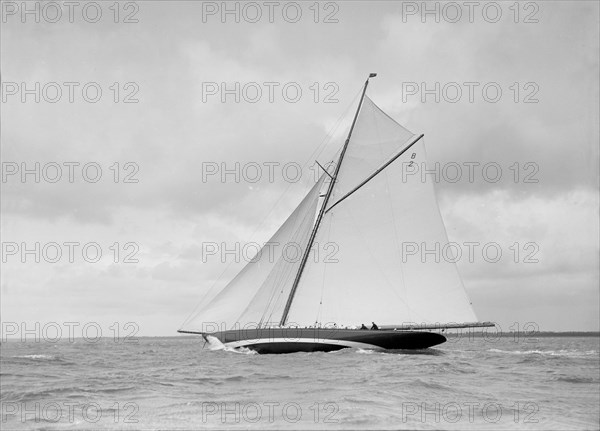 The cutter 'Shamrock' beating upwind, 1912. Creator: Kirk & Sons of Cowes.