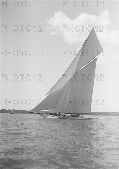 The 19-metre cutter 'Norada' sailing close-hauled, 1911. Creator: Kirk & Sons of Cowes.