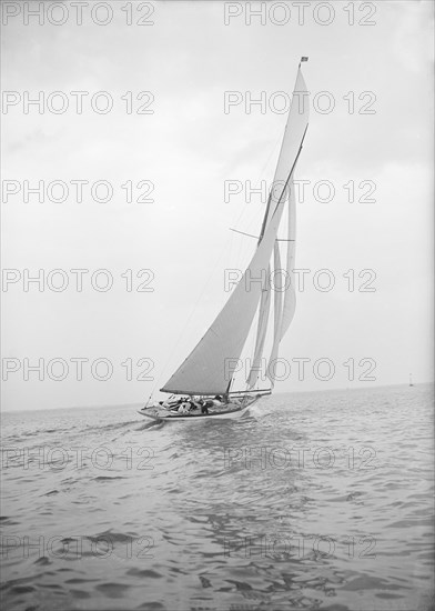 The 15 Metre 'Paula III' sailing close-hauled, 1913. Creator: Kirk & Sons of Cowes.