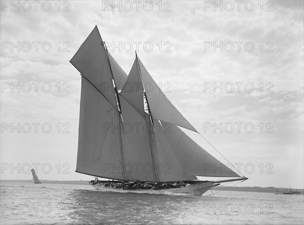 The beautiful schooner 'Cetonia' making good headway, 1911. Creator: Kirk & Sons of Cowes.