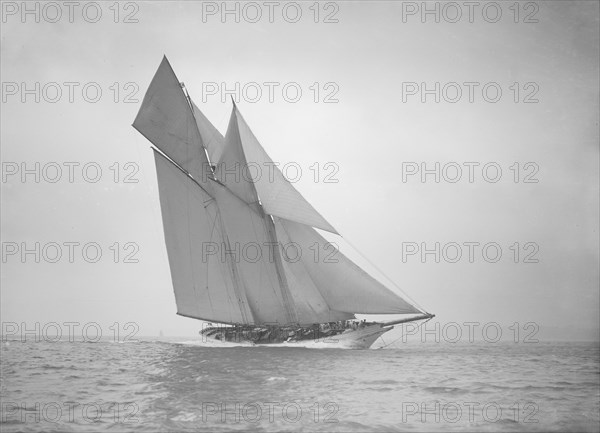 The beautiful schooner 'Cetonia' making good headway, 1911. Creator: Kirk & Sons of Cowes.