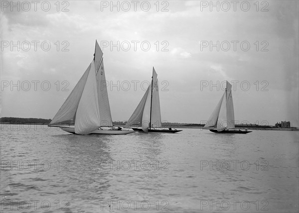 No wind for the 8 Metre class 'The Truant', 'Spero' and 'The Antwerpia IV', 25th May 1912. Creator: Kirk & Sons of Cowes.