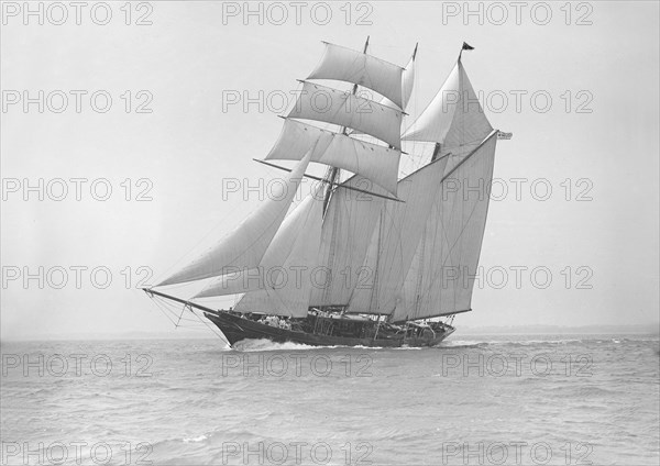 The auxiliary schooner 'La Cigale' sailing close-hauled, 1913. Creator: Kirk & Sons of Cowes.