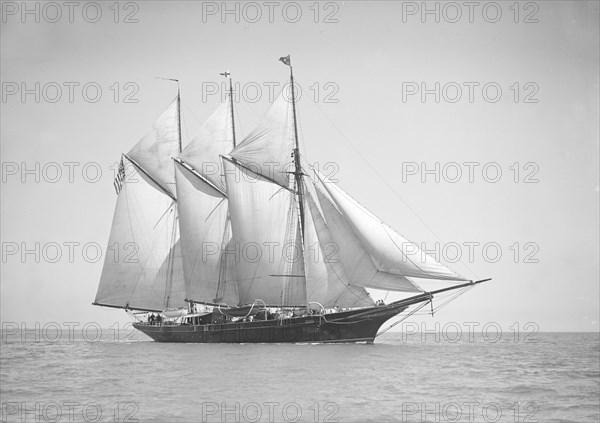 The three-mast auxiliary schooner 'Invincible', 1911. Creator: Kirk & Sons of Cowes.