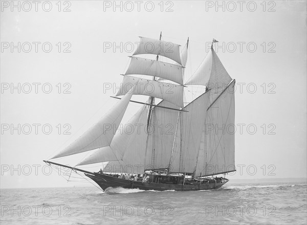 The auxiliary schooner 'La Cigale' sailing close-hauled, 1913. Creator: Kirk & Sons of Cowes.