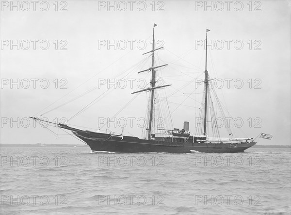 The auxiliary schooner 'Xarifa' at anchor, 1912. Creator: Kirk & Sons of Cowes.